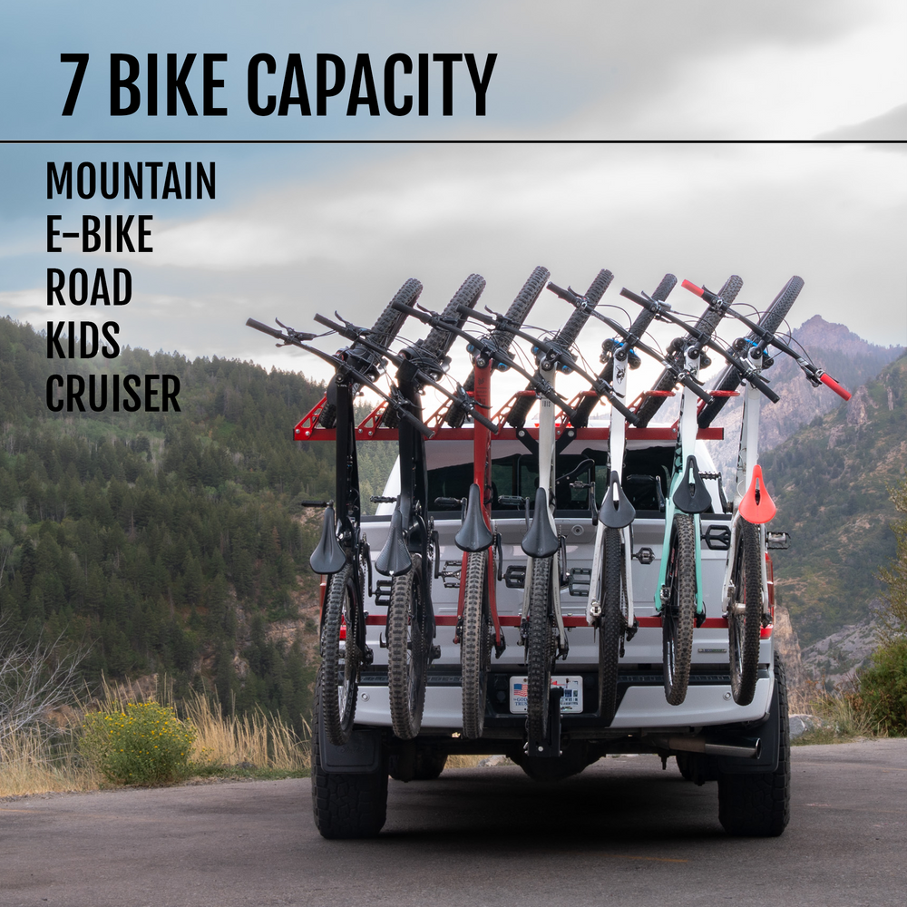 Truck with bike rack carrying multiple bikes in a mountainous area