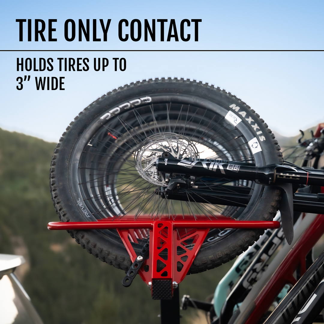 Bicycle wheels mounted in a MAX rack with text indicating tire width compatibility.