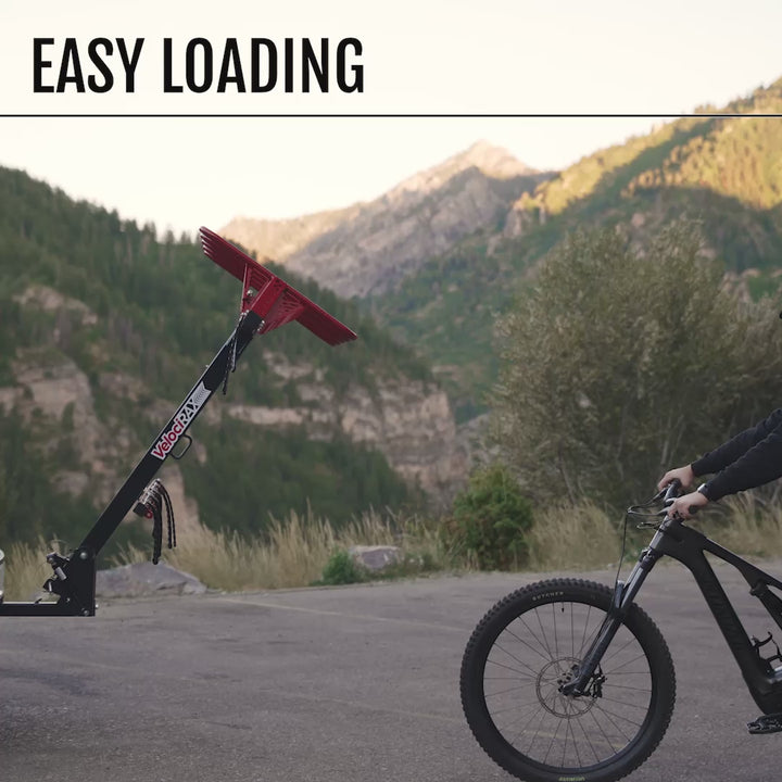 Video of person loading a bike onto a MAX rack.